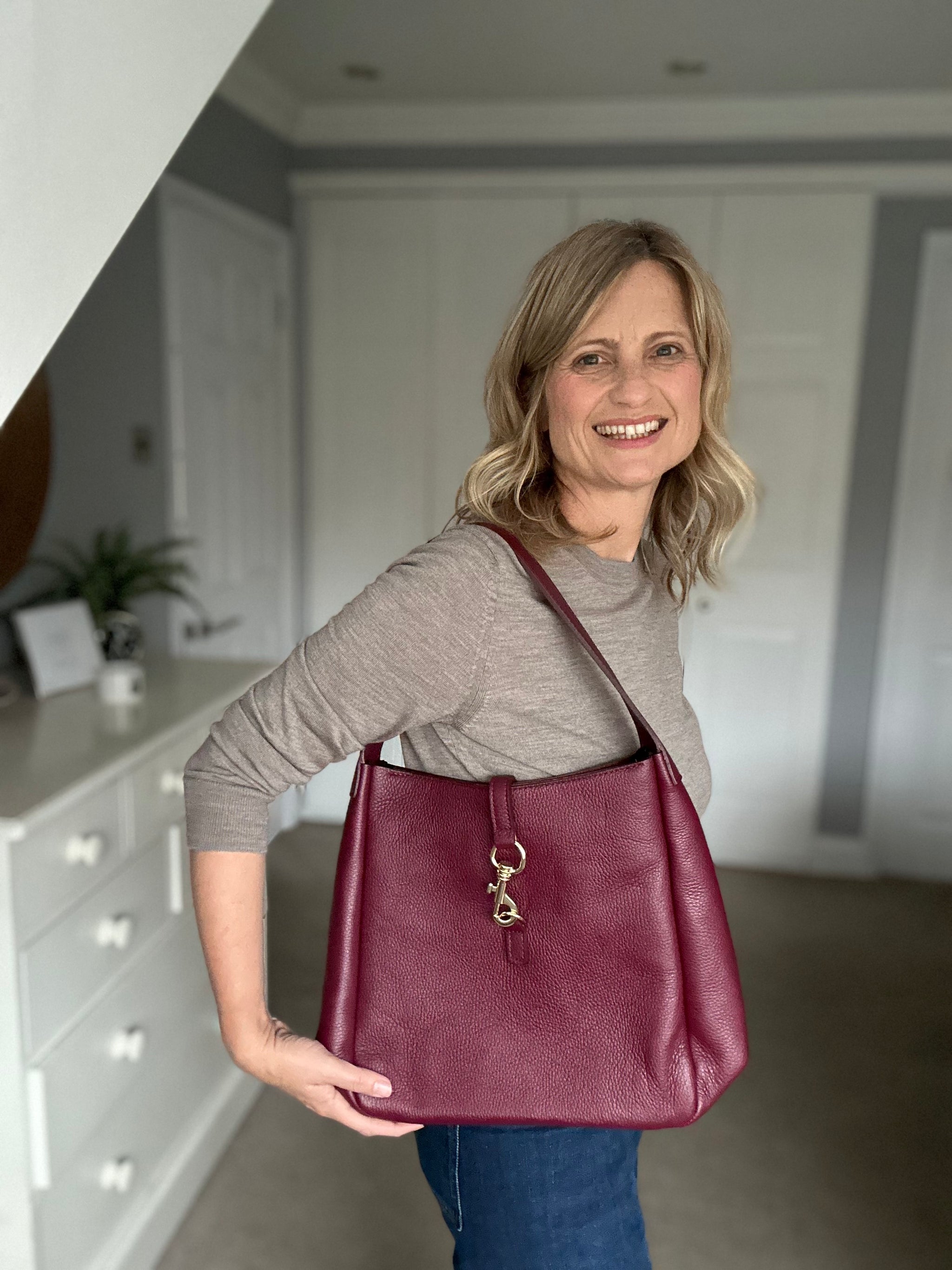 Burgundy leather handbag on sale