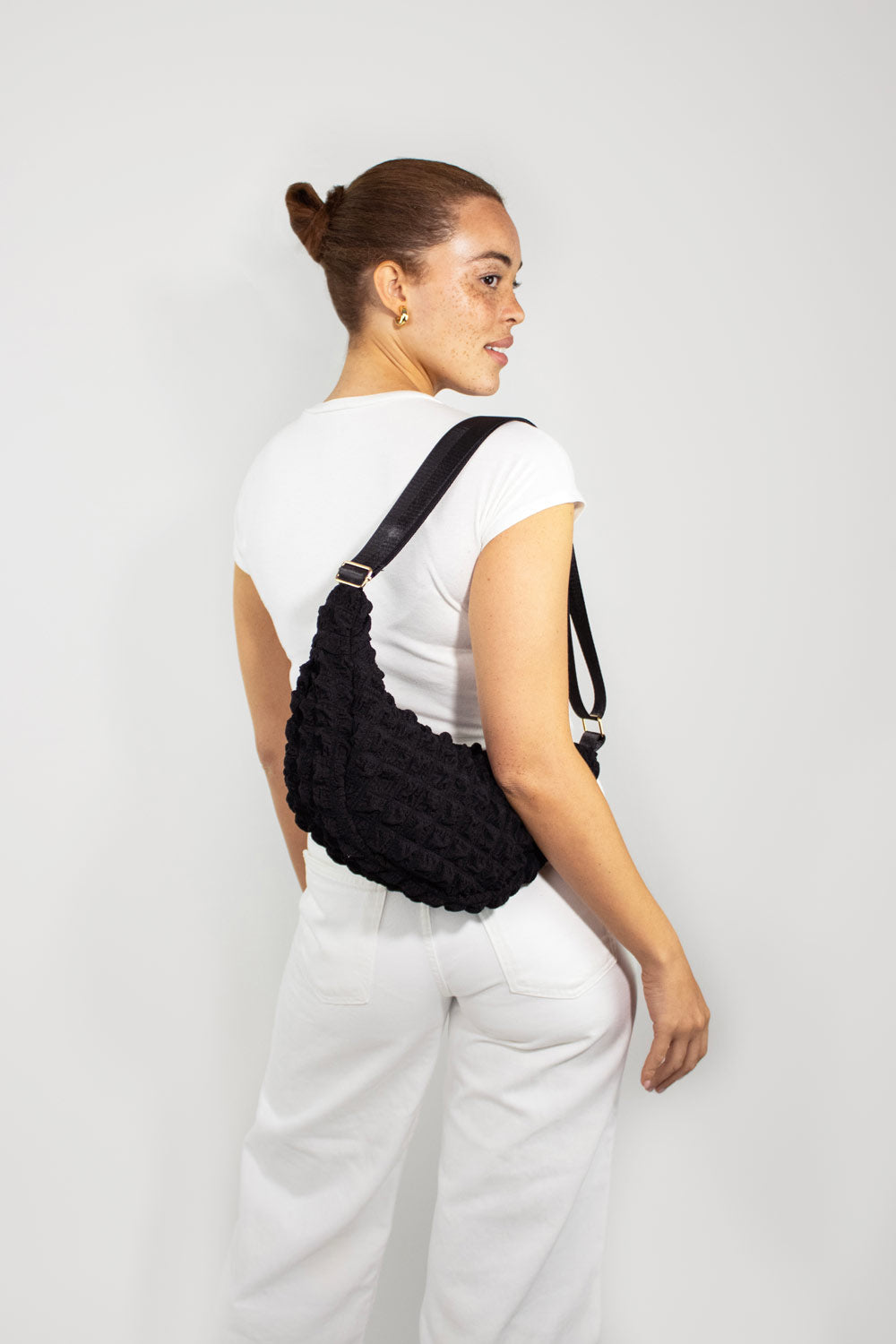 Kind Bag Black Recycled Fabric Crossbody on model