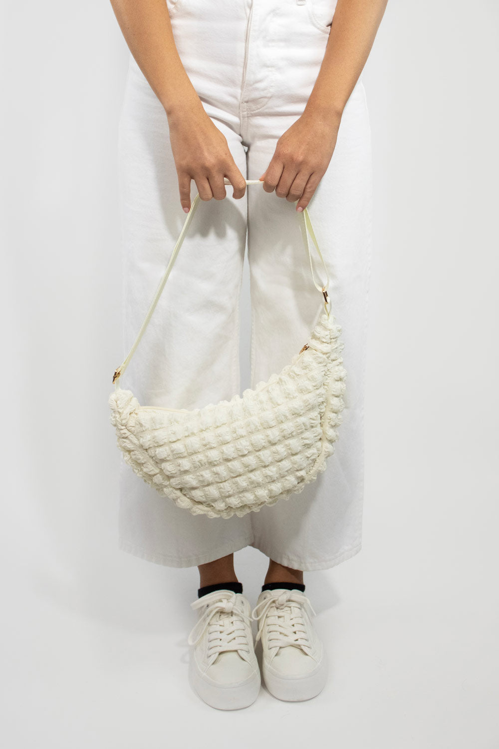 Kind Bag Cream Recycled Fabric Crossbody on model