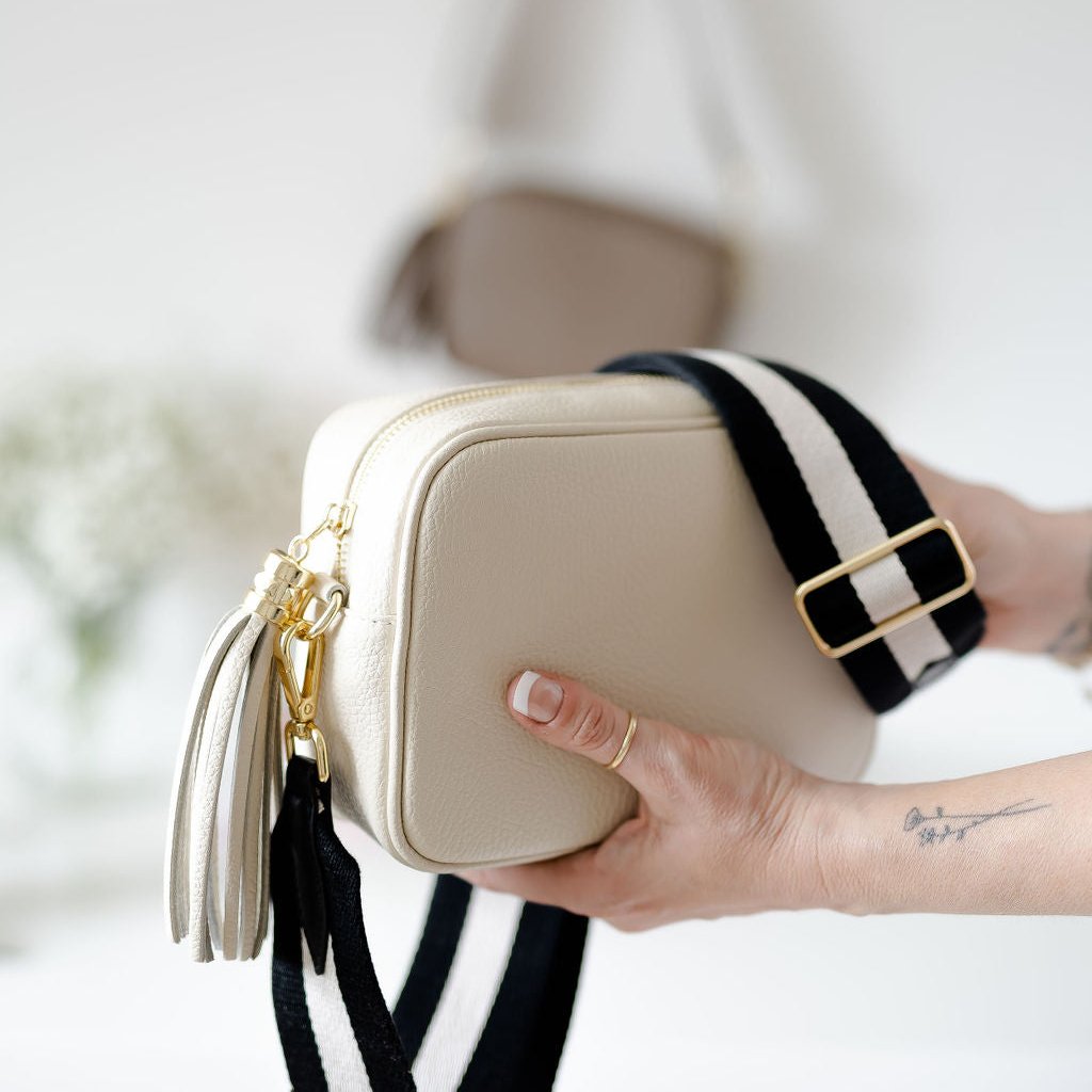 Cream Leather Tassel Cross Body Bag with monochrome stripe strap