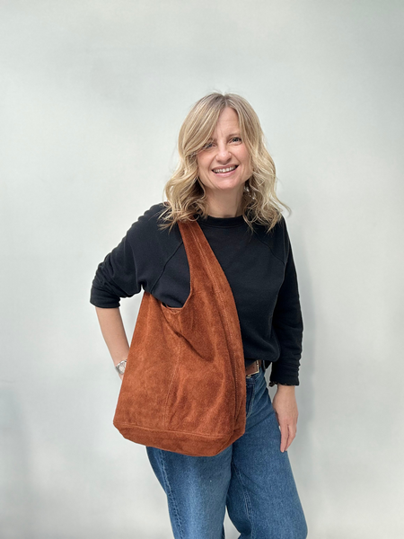 Light chocolate suede slouchy tote bag carried by Cathy 