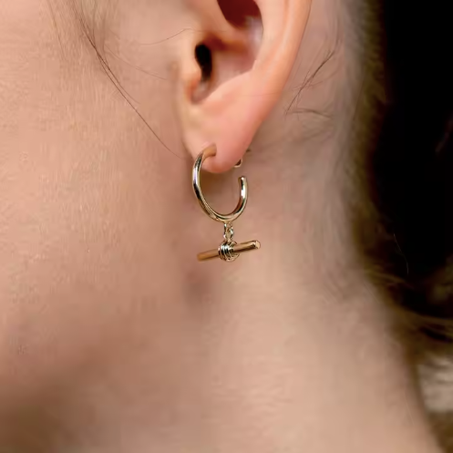 Silver T Bar waterproof earrings from MisGraceful on a model