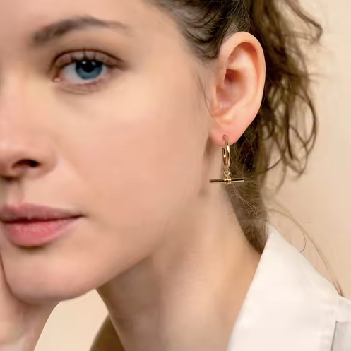 Gold T Bar waterproof earrings from MisGraceful on model