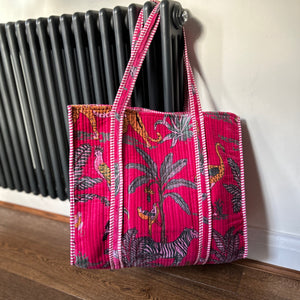 Pink jungle print velvet large tote bag hanging up