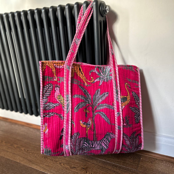 Pink jungle print velvet large tote bag hanging up