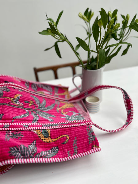 Pink jungle print velvet large tote bag on table