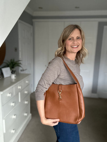 tan Leather womens Shoulder Bag from Alice's Wonders worn by Cathy